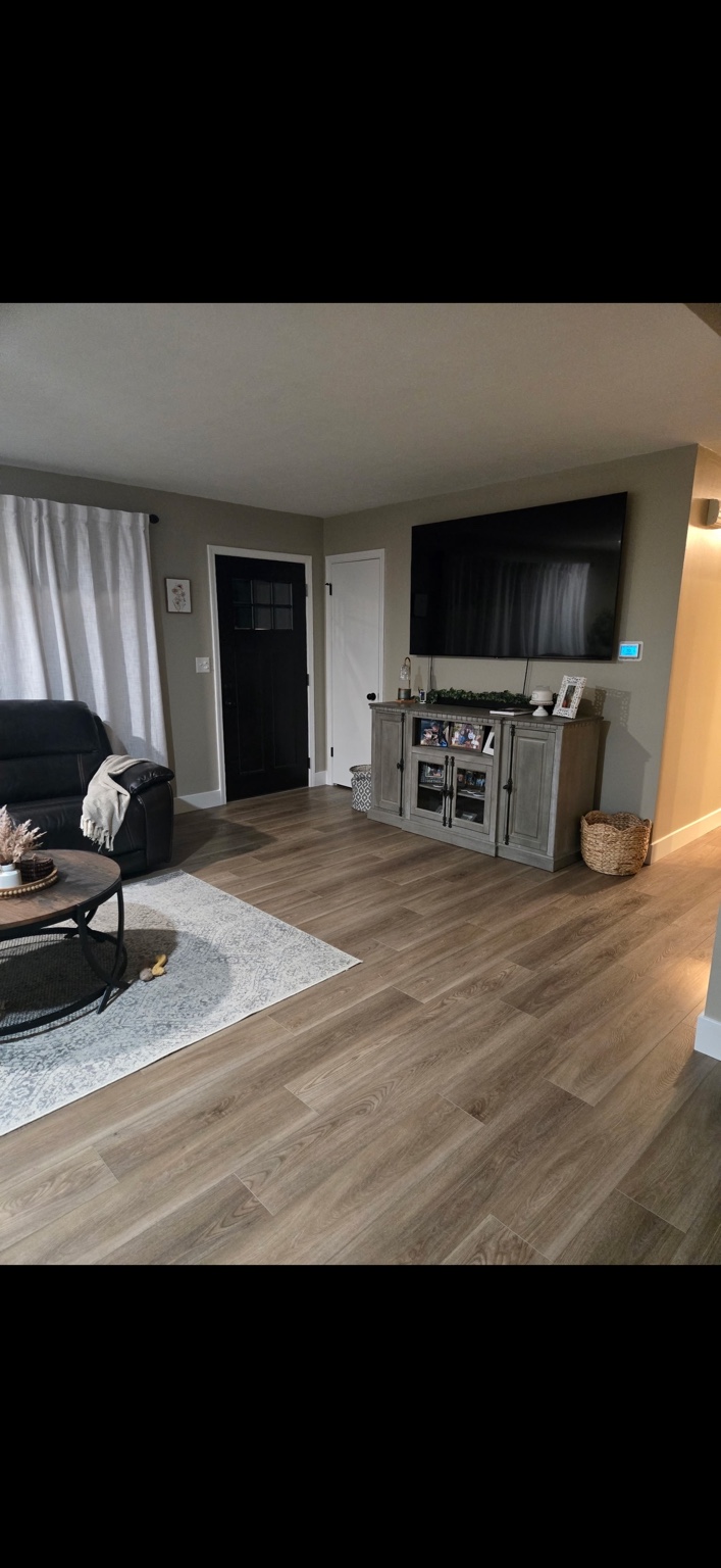 Living room after new luxury vinyl plank flooring