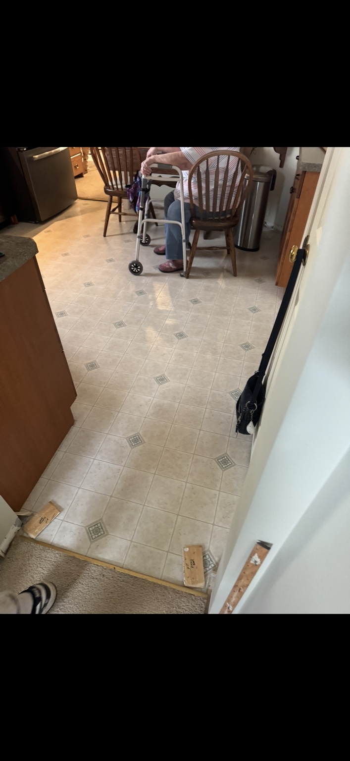 Kitchen and dining floor before replacement