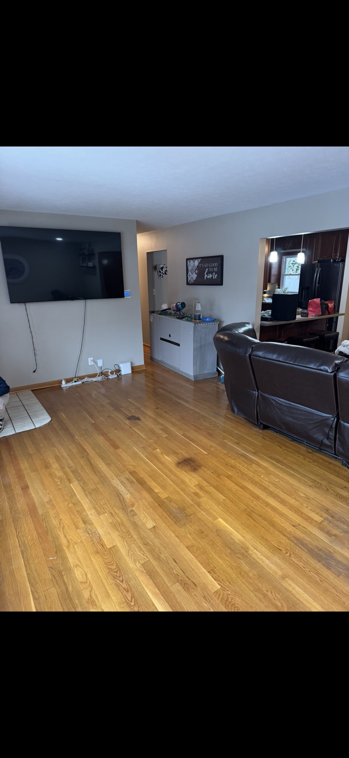 Living room hardwood before flooring update